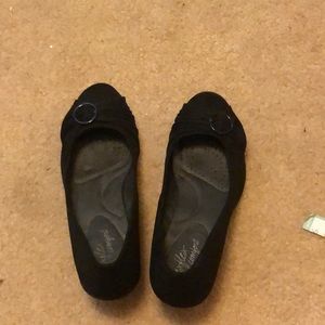 Black shoes with a slight wedge heel